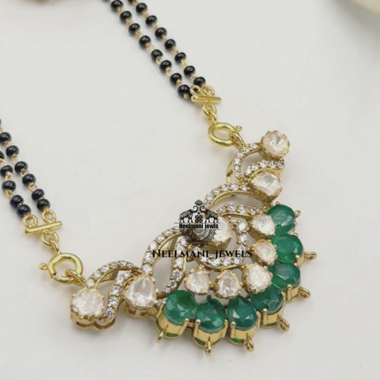  Mangal  sutra  and earrings with Neelmani Jewels branding.
