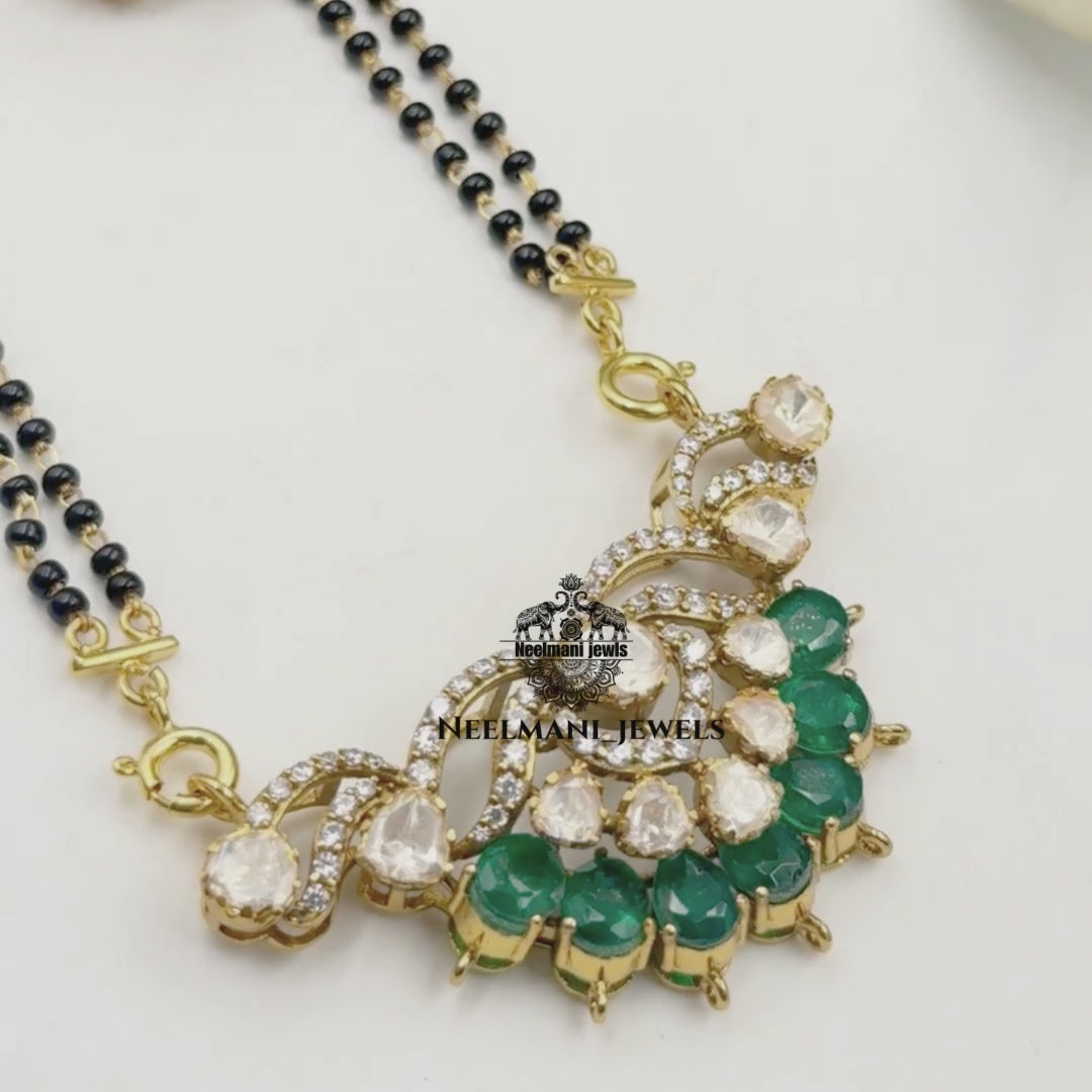  Mangal  sutra  and earrings with Neelmani Jewels branding.